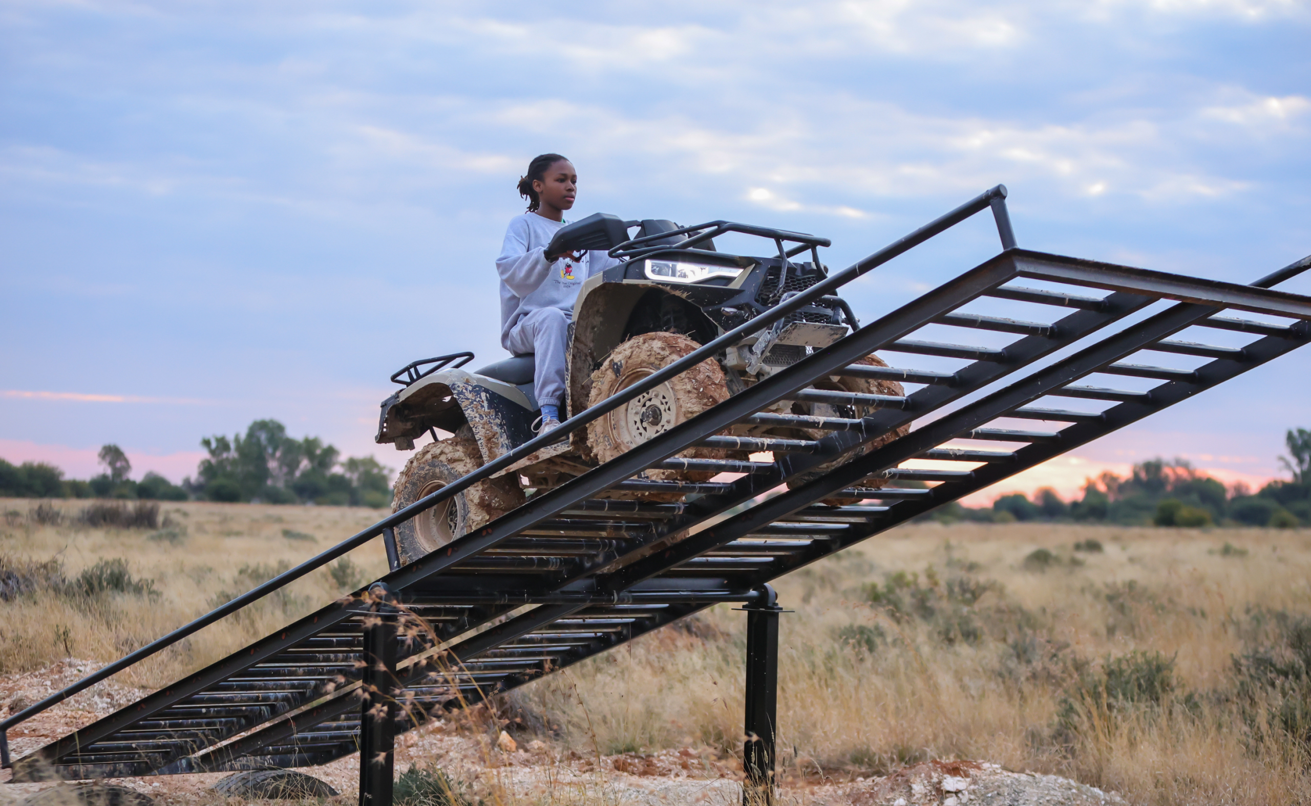 nelo's farmyard and adventure in kimberley northern cape quad bike driving over the seesaw with a girl on it